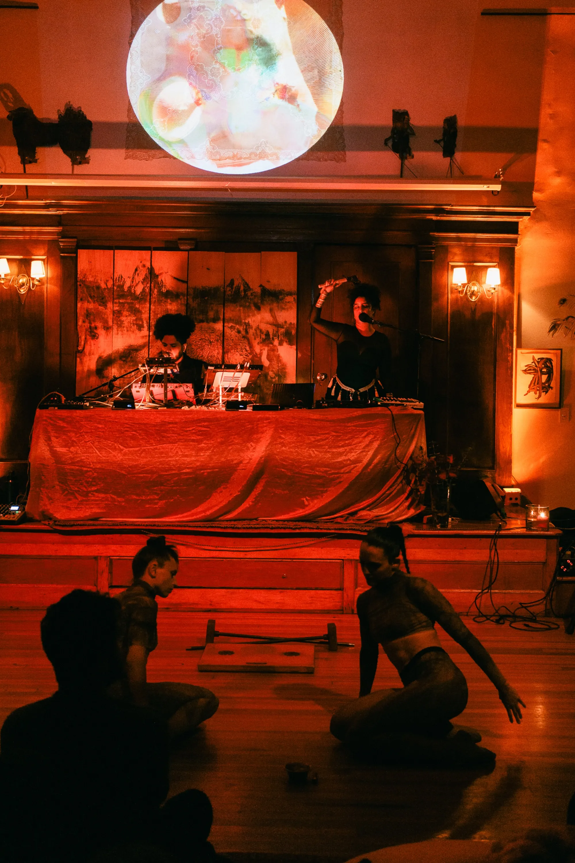 Global artist Benjamin Urbaez and DJ Dreeemy global music performer on stage at intimate Harlem venue