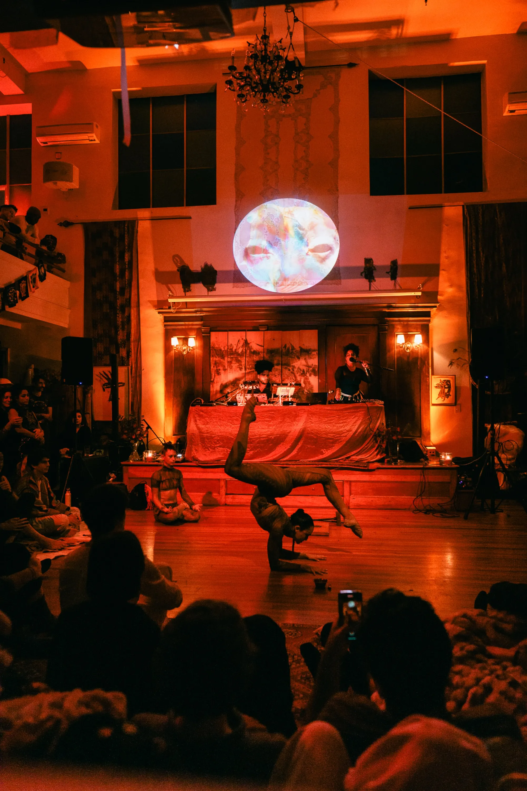 Global artist Benjamin Urbaez and DJ Dreeemy audience immersed in live spiritual music experience in Harlem