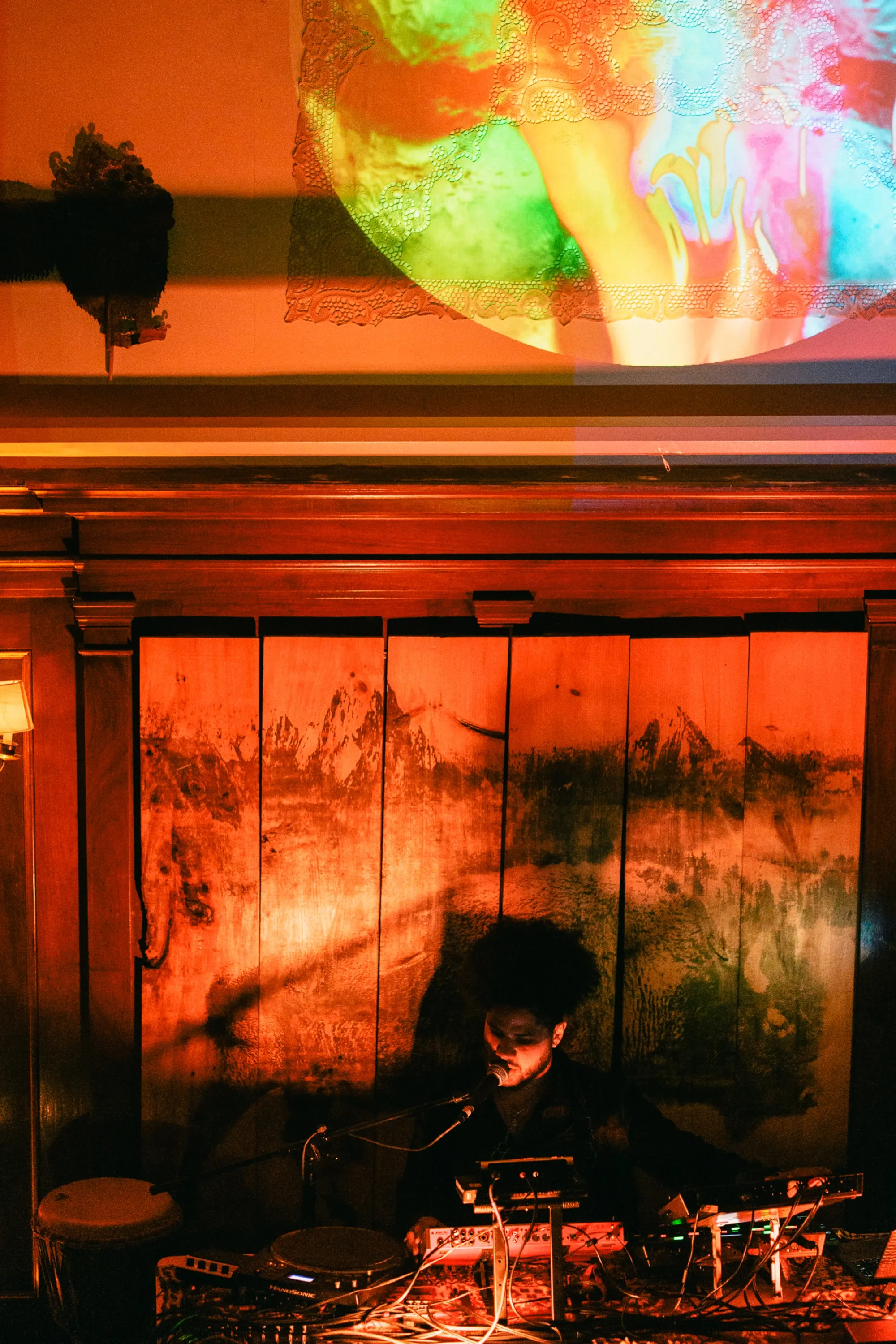 Global artist Benjamin Urbaez and DJ Dreeemy on microphone performing spoken word at Viewcy Harlem